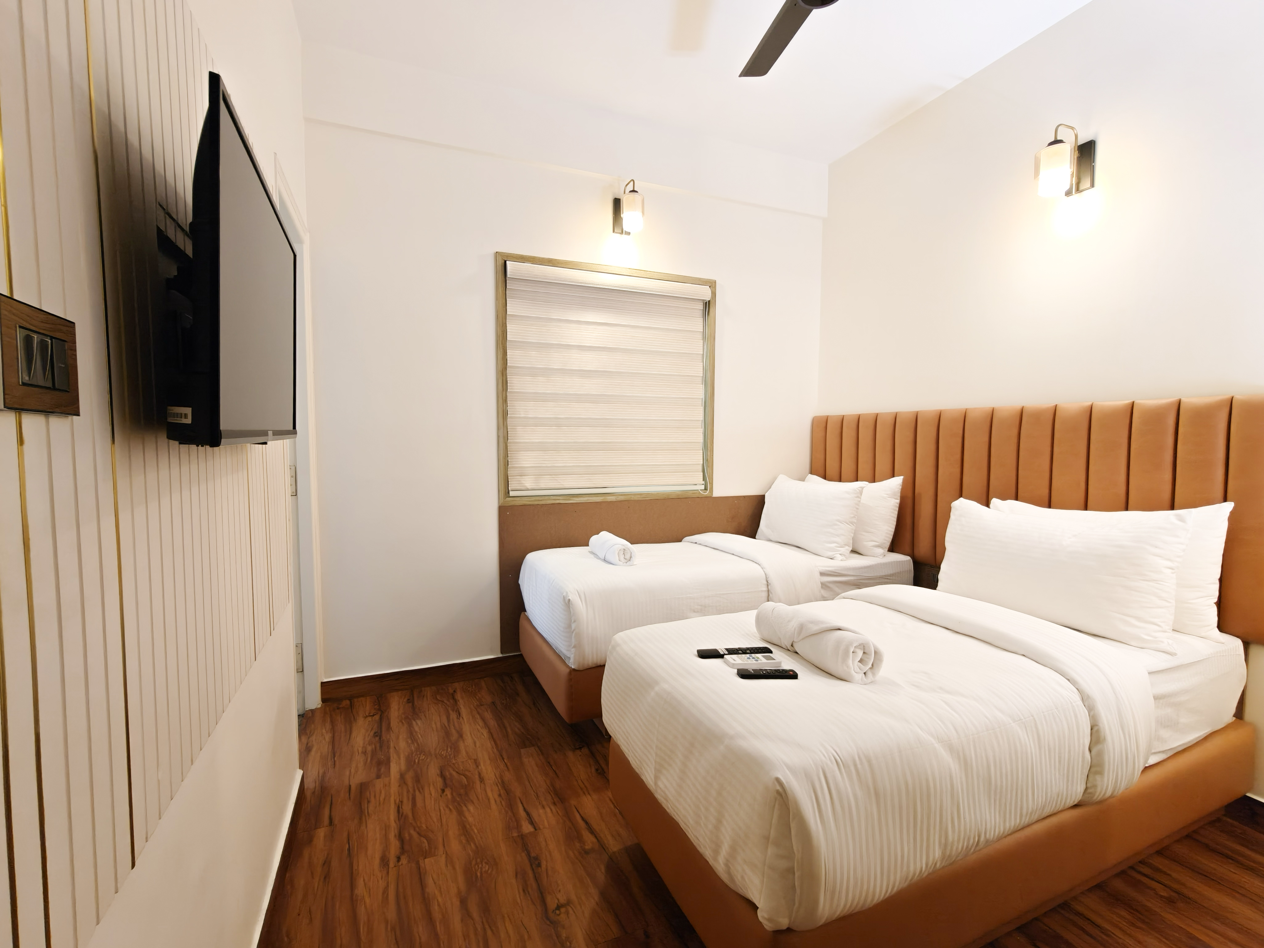 Clean and organized apartment bedroom with fresh linens and professional housekeeping